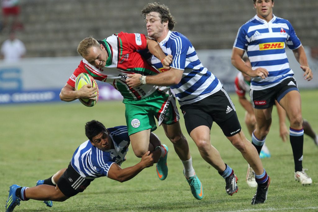 rugby players fight for the ball
