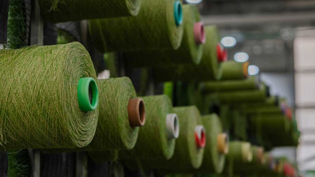 spools of artificial grass ready for production