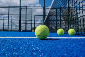 tennis balls lie on the artificial court