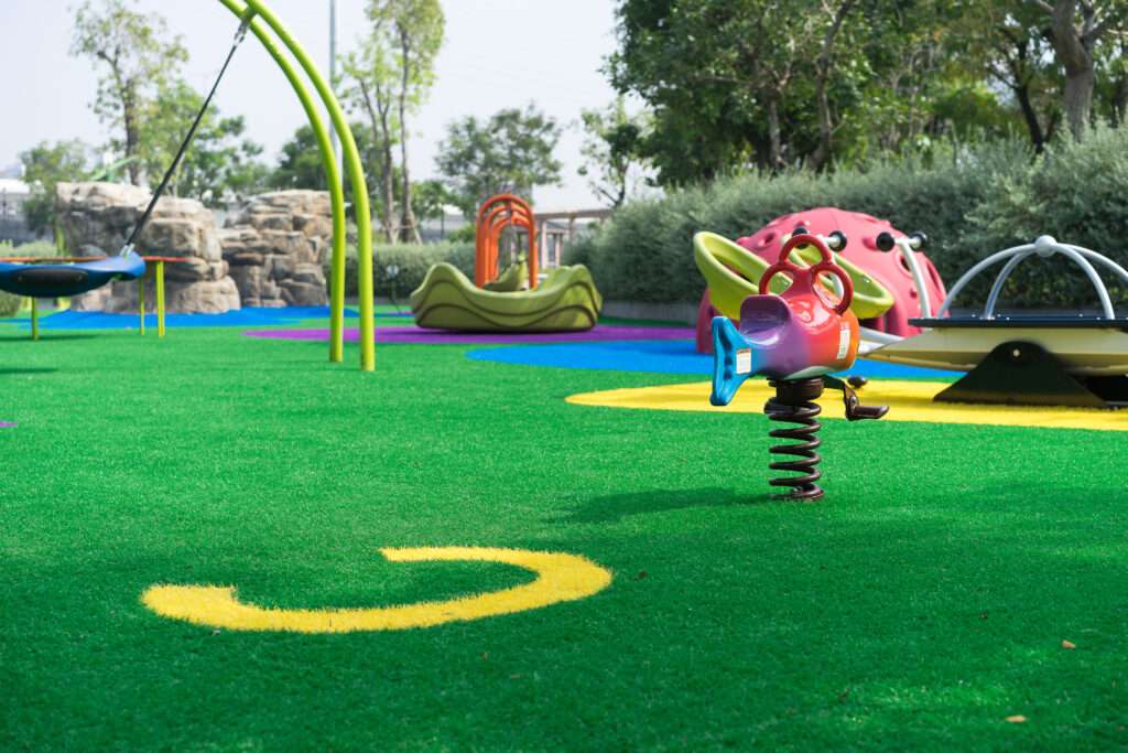 Colorful playground for kids made by artificial grass design